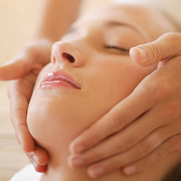 lady in our Cardiff clinic having shiatsu holistic facial